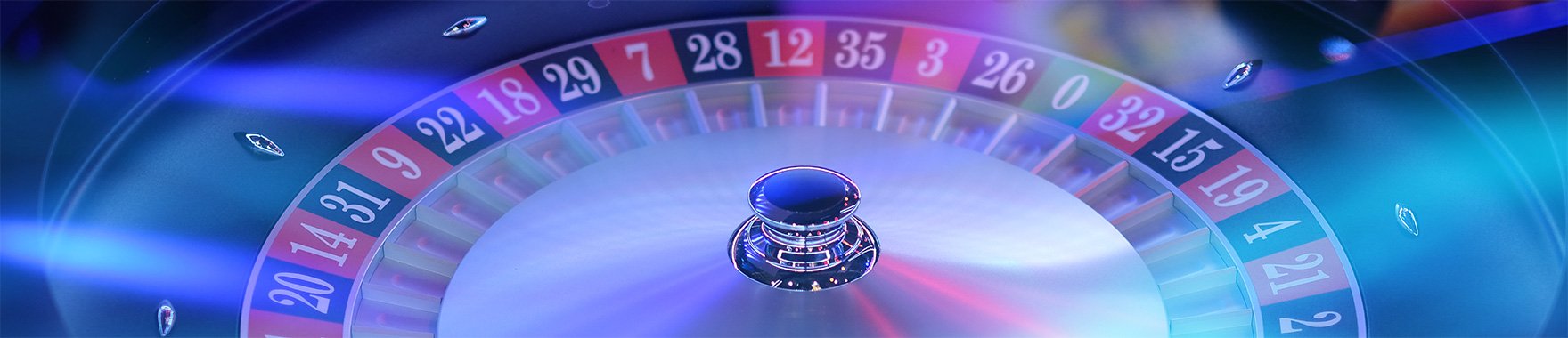 Live casino dealer table with cards and chips on screen